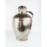 A metal milk / water pitcher.