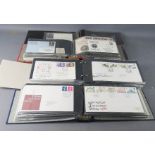 A group of four albums of First Day covers.