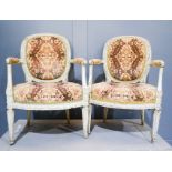A pair of French painted armchairs, 19th century, with upholstered back and seats.
