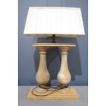 An oak twin table lamp, on a rectangular base with cream silk pleated shade, 69cm tall.