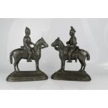 A pair of cast metal door stops, Boer War, one depicting general Wesley.