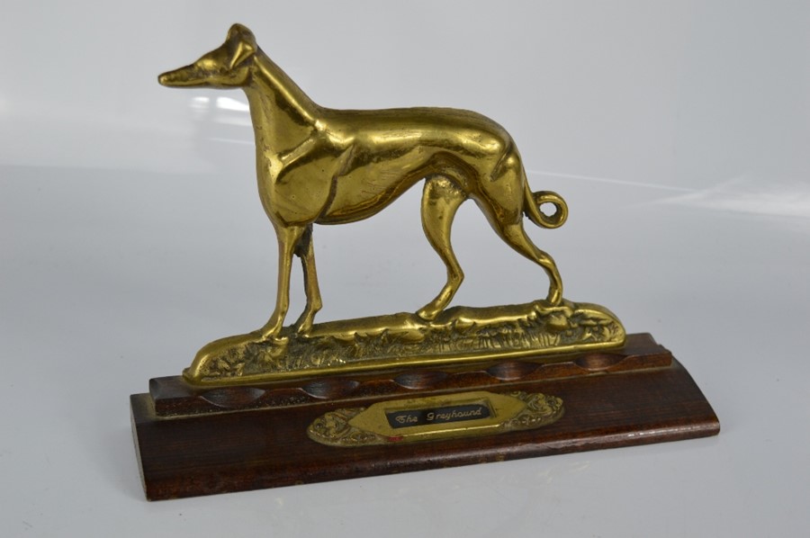 A brass ornament / door stop titled The Greyhound, 20cm high.
