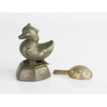 A Burma opium weight in the form of a duck circa 1800, together with a silver opium scoop inset with