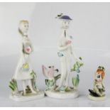 A pair of Rosenthal German porcelain figurines, 15cm high, and a further figure.