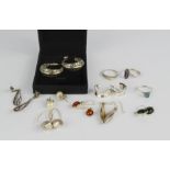 A quantity of silver rings, earrings, including a pair of pearl studs.