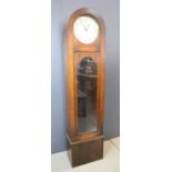 A 1930s grandmother clock, in an oak case.