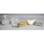 A silver clothes brush, naive ceramic bird, crystal bowl and jar.