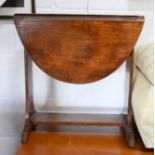 A small oak drop leaf side table.