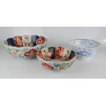Two imari bowls, together with a blue and white Chinese bowl with character marks to the base.