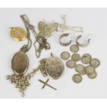 A group of silver lockets, butterfly brooch, silver threepences and other items.