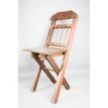 A childs folding chair, silver plated serving dish, and a book stand.