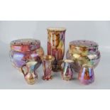 A group of lustre ware to include flower frog, small jugs, vase, and other items.