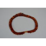 An amber necklace with graduated flat cut beads.