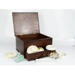A 19th century box containing ceramic artists brush dishes, inkwell, bottle and other items.
