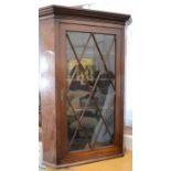 A corner cabinet, 19th century with astrigal glazed.