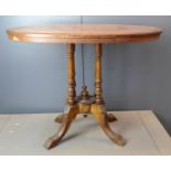 A mahogany inlaid centre table, with oval inlaid marquetry top.