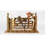 A novelty pipe rack in the form of a gate, 20 by 33cm.
