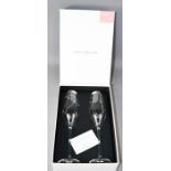 A Royal Doulton 'Promises' pair of champagne flutes, made with Swarovski elements, in original box.