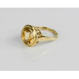 A 9ct gold and citrine ring, brilliant cut, size Q, 4.8g.