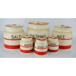 A collection of Sadlers red stripe storage jars: Sultanas, Rice, Salt in large, and Baking Powder,