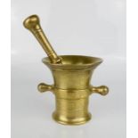 A brass pestle and mortar.