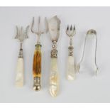 A group of silver spoons, sugar nips, horn handled fork and mother of pearl forks and a butter