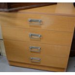 A chest of four drawers.