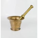 An early brass pestle and mortar.