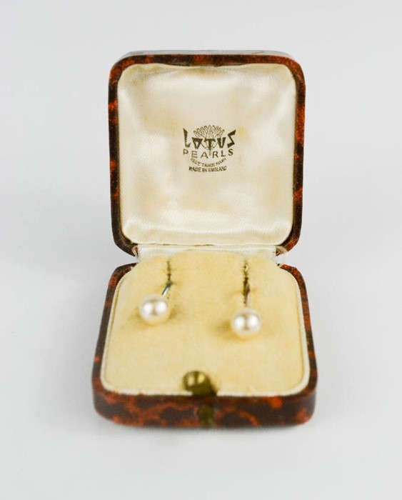 A pair of silver and pearl earrings, in the original Lotus Pearls box.