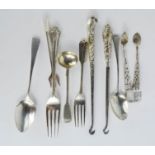 A quantity of silver spoons, fork, sugar nips, and two silver handled button hooks, 3.22toz.