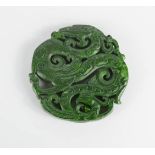 A Chinese carved Nephrite green jade dragon pendant.