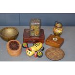 A quantity of treen boxes, a New Zealand bee toy, and other items.