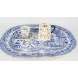 A large blue and white Willow Pattern platter, together with a 19th century cup and a comical 'In