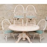 Bo Bo Lifestyle antique white pine dining table with extra leaf together with matching chairs.