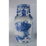 A 20th century blue and white Chinese vase with dog of fo shoulders, 38cm high.