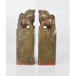 A pair of Chinese soapstone seals, carved with dogs of fo.