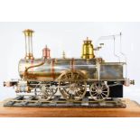 A scratch built steel, copper and brass working Locomotive raised on a section of railway track,