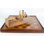 A wooden chess set with chess pieces.