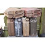 A group of six petrol cans, one dated 1945.