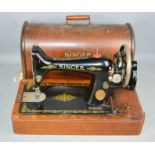 A Singer sewing machine in a case.