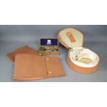 A group of gentleman's dress leather pouches, together with a Wilkinson Sword razor.