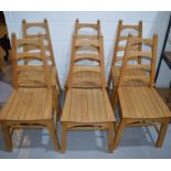 A set of oak chairs, with graduated ladder backs.