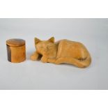 A carved treen cat, and a lignum vitae pot.