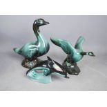 A Poole pottery dolphin, and two Canadian Blue Mountain ducks.