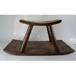 An African antique rocking stool.