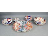 A group of imari, three bowls and one oval dish.