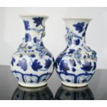 A pair of miniature blue and white Chinese vases, 10cm high.