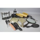 A ebony dressing table set, with tray, manicure set, hair pin stand, and two plated hand mirrors.