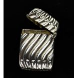 A silver vesta case with reeded decoration, Birmingham 1896, 0.62toz.