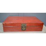 A Chinese red lacquered travelling trunk.